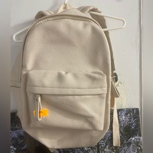 Faux leather backpack. Cream colored. Good condition- like new.